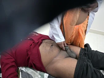 Indian be enamoured of examines patient's dick in polyclinic bed fro a naughty soutache